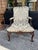 Handsome pair of antique English armchairs crafted in mahogany in an elegant form with floral carvings on the arms, legs...