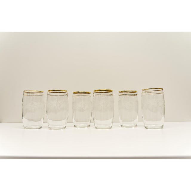 A set of six glass tumblers attributed to Bartlett Collins. Each glass features a beautifully detailed grapevine etching,...