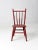 This antique children's chair is a charming example of vintage craftsmanship and playful design. The petite red-painted...
