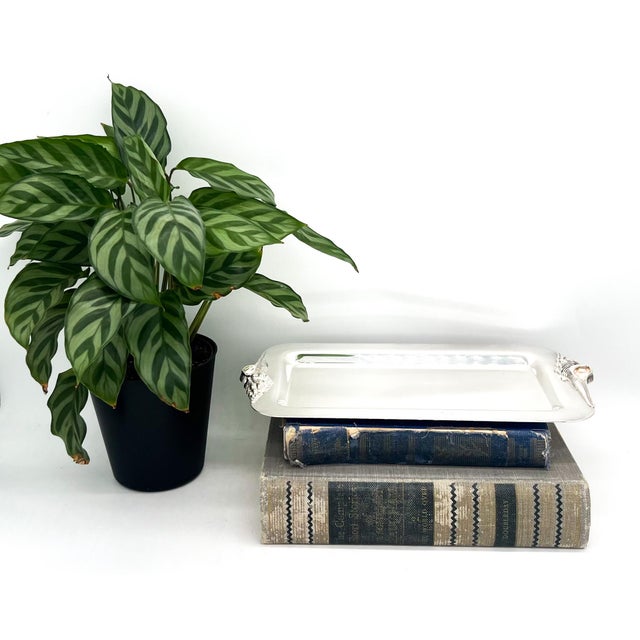 Stunning, mid to late 20th century silverplate serving tray by Gorham, featuring sculptural shell-form handles at each end...