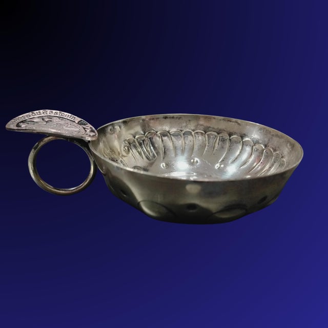 Antique Tastevin with the Seal of the Prestigious Confrérie des Chevaliers du Tastevin This antique tastevin bears the...