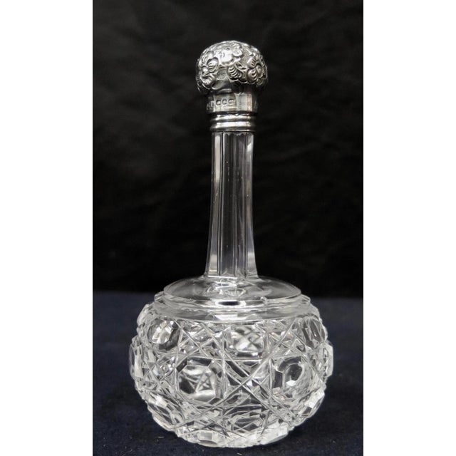 This vintage United Kingdom sterling silver & crystal scent bottle dates from the early 20th century. It is a...