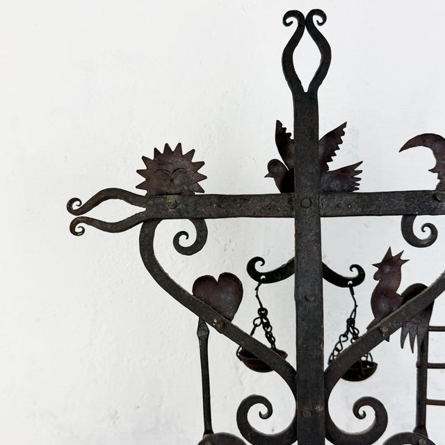 This striking hand-forged iron sculpture by renowned Mexican folk artist Guadalupe Hermosillo Escobar reinterprets the...