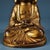 This is a beautifully aged Chinese Buddhist sculpture depicting the historical Buddha seated in full lotus position...