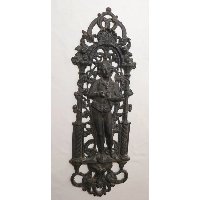 Up for sale is a wonderful antique figural cast iron relief wall plaque. it's made of very thick black painted iron, is a...