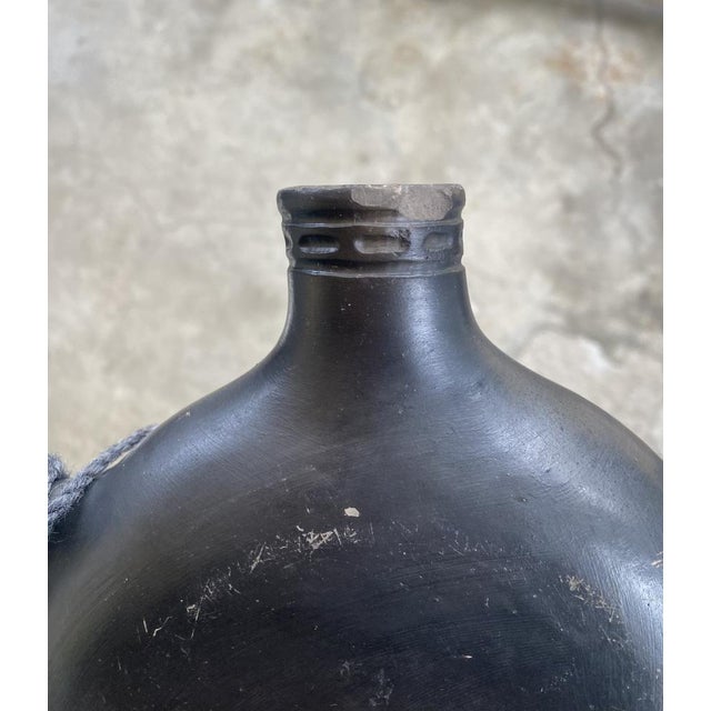 Andean Blackware Ceramic Canteen with Zoomorphic Relief, South America, 20th Century, in Good conditions. Designed 1920 to...