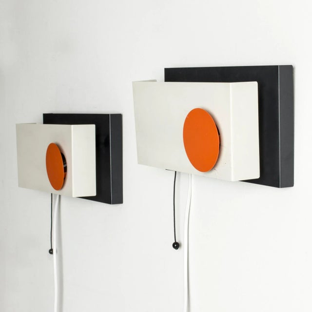 - Pair of strikingly graphic wall lights by Sven Aage Holm Sørensen - Made from metal lacquered white - Black and orange...