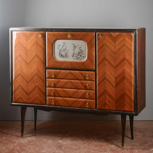 This imposing mid-twentieth-century sideboard is a refined example of italian modernism, combining sophisticated...
