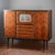 This imposing mid-twentieth-century sideboard is a refined example of italian modernism, combining sophisticated...
