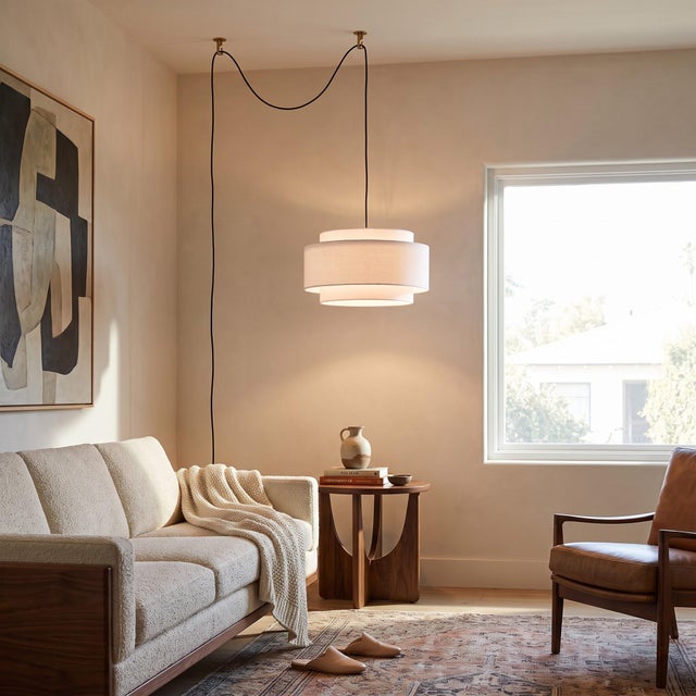 The Coronado Kit is a sophisticated lighting solution featuring a drum-shaped white linen shade and a weathered brass...
