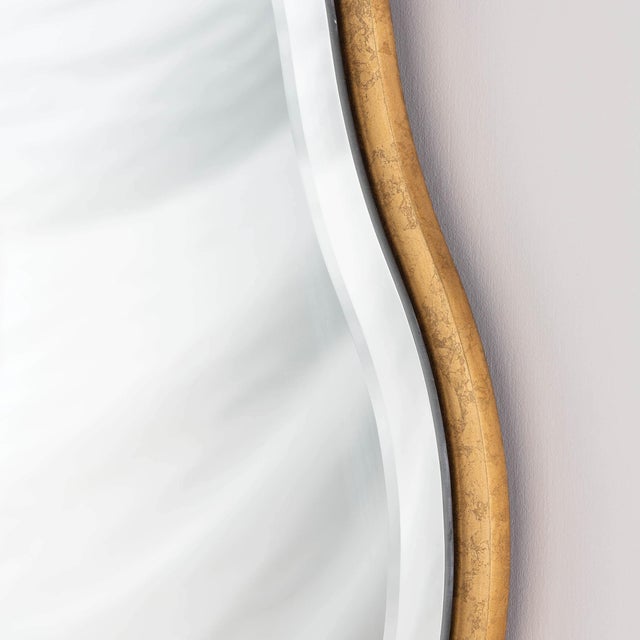 An undulating gilded frame and beveled mirror edge gives the Candice mirror a feminine, glamorous look. Sure to look...