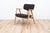 FB14 Armchair by Cees Braakman. The chairs comes with a black upholstery on the seating and backpiece on a wooden frame. I...