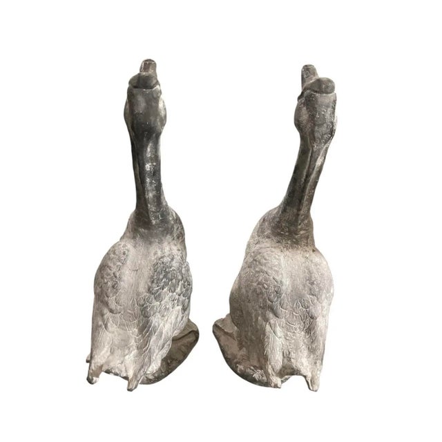 Enhance your indoor or outdoor space with this striking pair of vintage goose sculptures. Crafted with a heavy, textured...