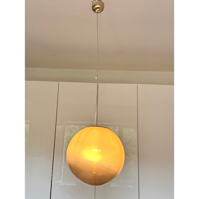 Impressive pendant light in clear and fume' Murano glass, the glass change color by take off/on the light Handmade glass...