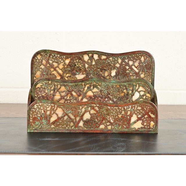 A gorgeous antique Arts & Crafts or Art Deco period bronze and Favrile slag glass "Grapevine" pattern desk letter holder...