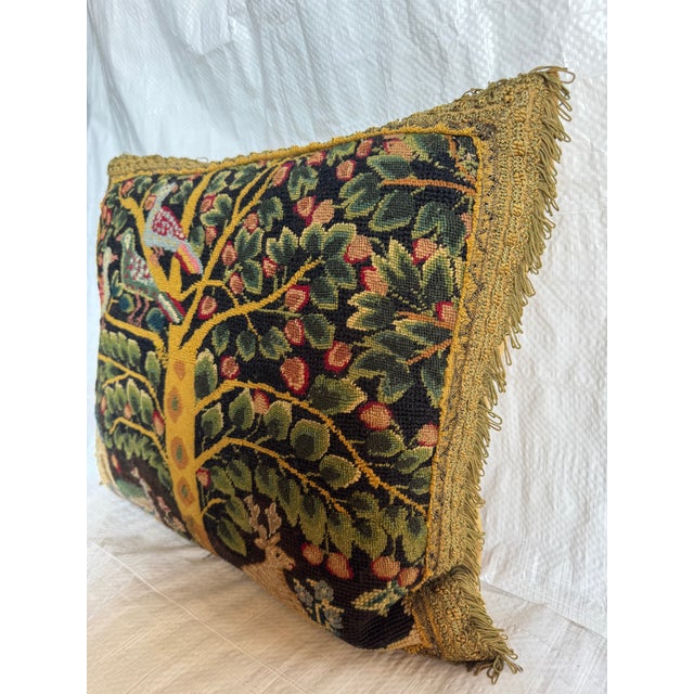 A rare and evocative 17th century English needlepoint tapestry pillow dating to circa 1600, finely hand worked in wool and...