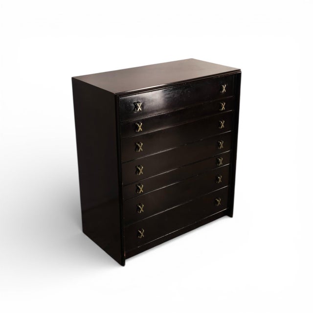 This 1960s Mid Century Modern highboy dresser designed by Paul Frankl for Johnson Furniture is a bold example of Hollywood...