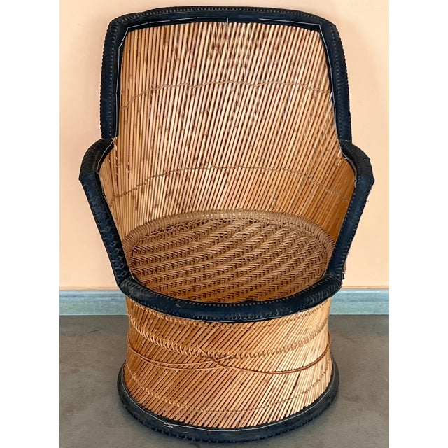 A wonderful pair of faux painted bamboo motif Armchairs with a glossy light tortoise finish. The sturdy frames with caned...