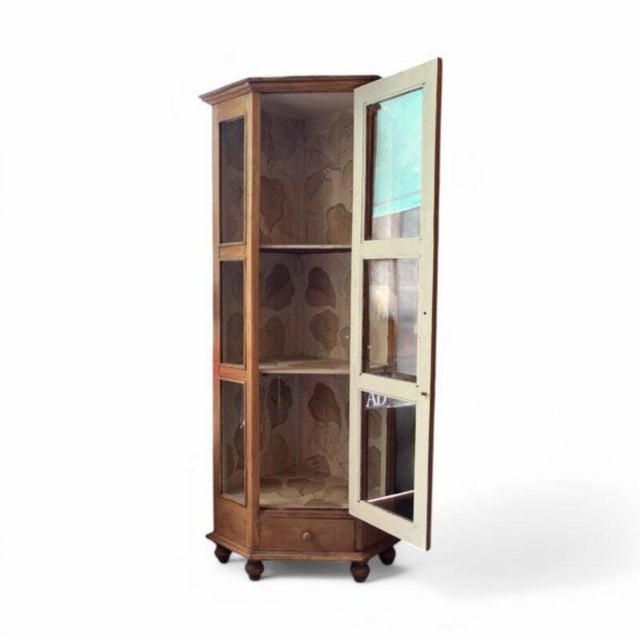 Corner cupboard with a hexagonal profile. Made in the late 19th or early 20th century from exceptionally light and...