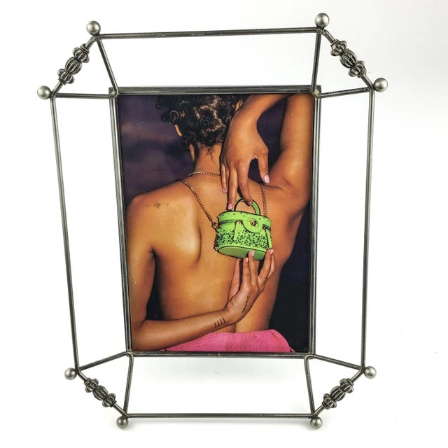 We love the open metal design of this frame. Any style of interior will work with this frame. Holds a 5 x 7 photo. Sits...