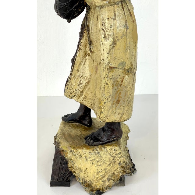 Austrian Cold-Painted Figure of a Musician, after Franz Bergmann Austria, circa 1900s An expressive Austrian cold-painted...