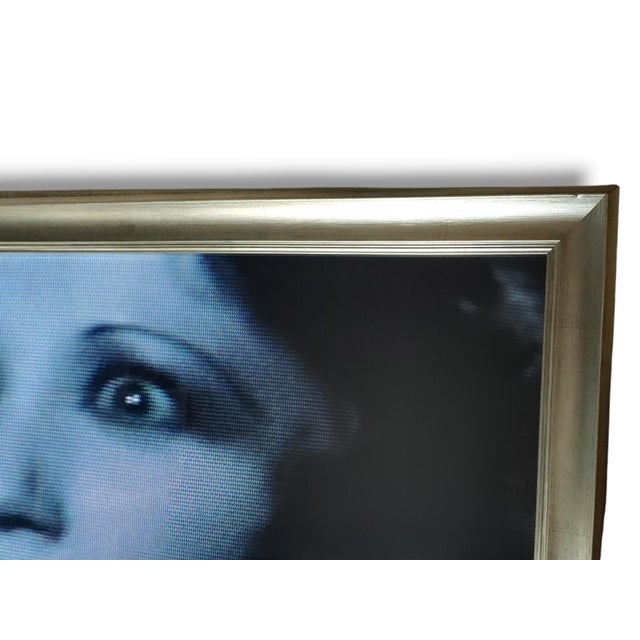 Vintage Gelatin print Photograph of an actress from a classic Hollywood movie scene. Framed under glass in a Silver Leaf...