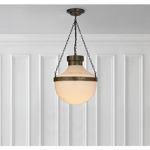 Celebrity Designer Michael Smith Modern Schoolhouse Lantern in Antique Brass with Verde Finish and Milk Glass Shade....