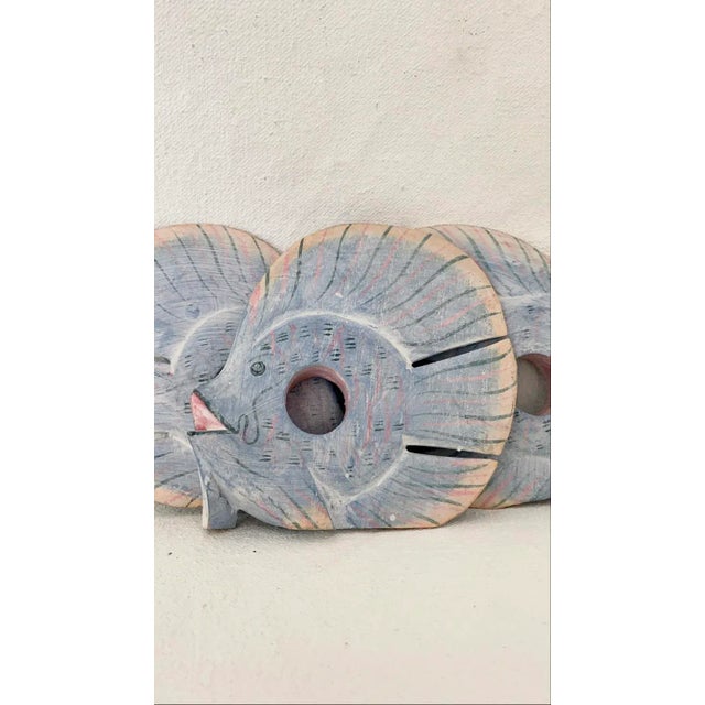 Vintage set of 8 painted wood tropical fish napkin rings. Painted in pretty pastel colors, they’ll add a whimsical touch...