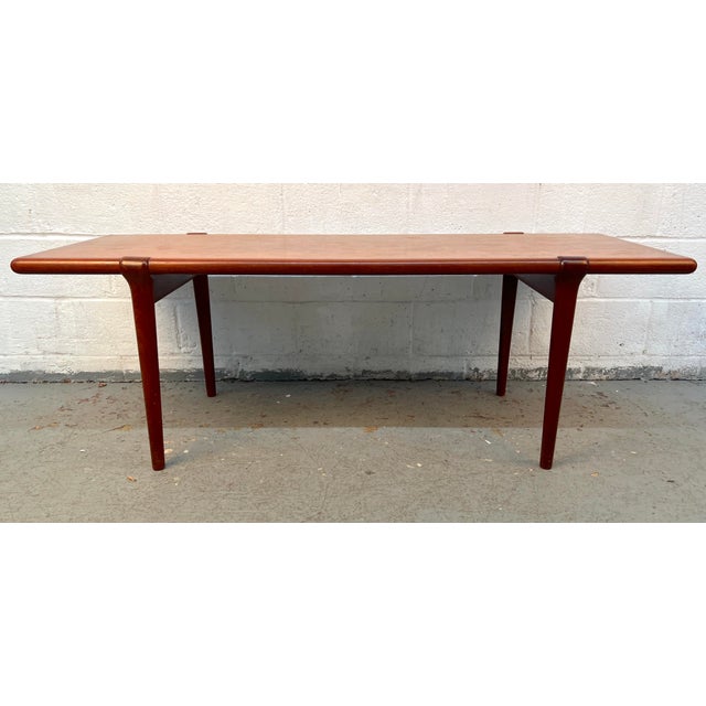 A beautifully crafted example of Danish Modern design, this mid-century teak coffee table by J.L. Møller embodies the...