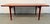 A beautifully crafted example of Danish Modern design, this mid-century teak coffee table by J.L. Møller embodies the...