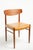 A pair of Danish teak dining chairs. The chair frames are made from solid teak, and they have new upholstery in premium...