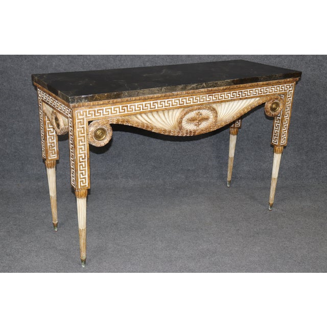 This striking Greek key–carved console table is one of those pieces that feels quietly architectural the moment it’s...