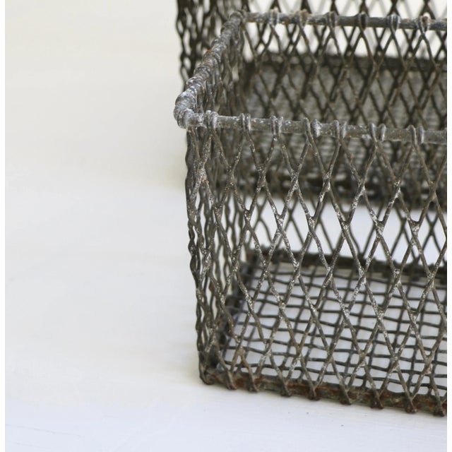 Set of four vintage wire baskets in various sizes. Largest is 6in x 6 in. Lots of patina. Industrial and practical. Good...