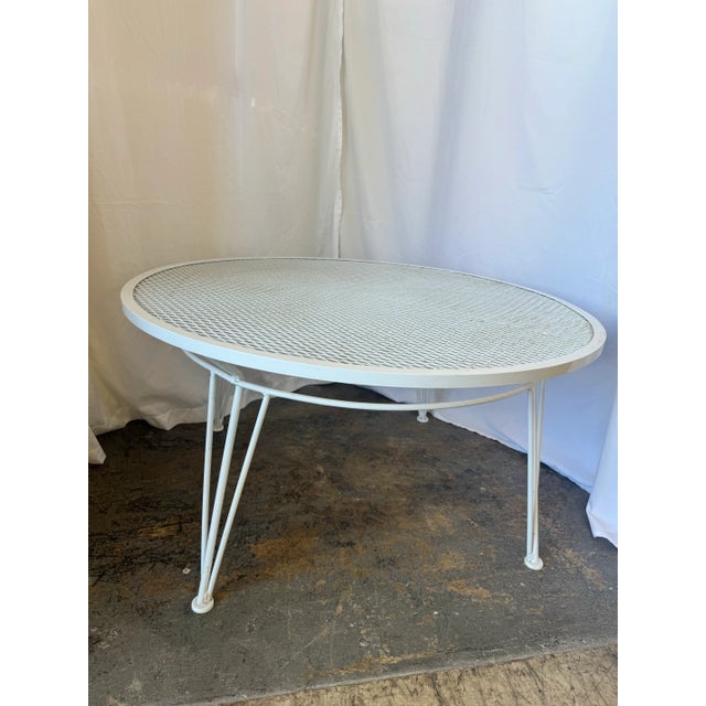 Metal round patio coffee table by Salterini. The table has been professionally sandblasted and powder-coated. There isn’t...