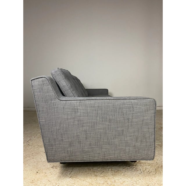 Fab 93" long sofa with 3 sets of dark walnut legs. Loose tufted seat and back cushions. Very comfy and forever styling....