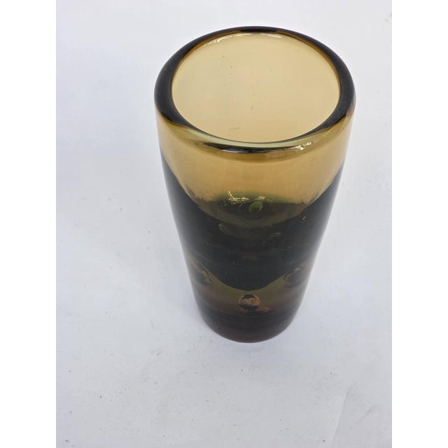 Green and amber glass vase combined with internal bubbles.It is very thick and heavy approx.3kg. When the sun hits the...