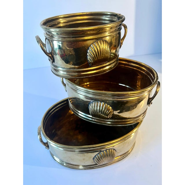 A beautiful set of three brass containers that all next inside each other. Apart they are perfect for use as planters,...