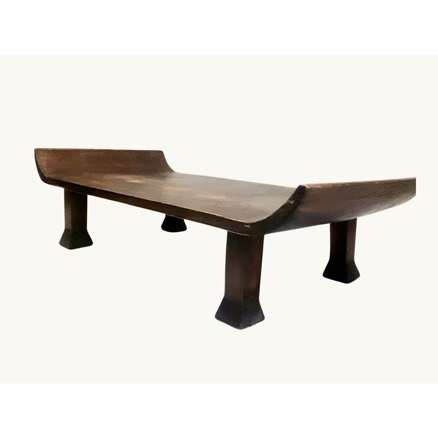 A beautifully crafted antique Chinese kang table in solid elm with a warm golden-brown patina. Its compact, low profile...