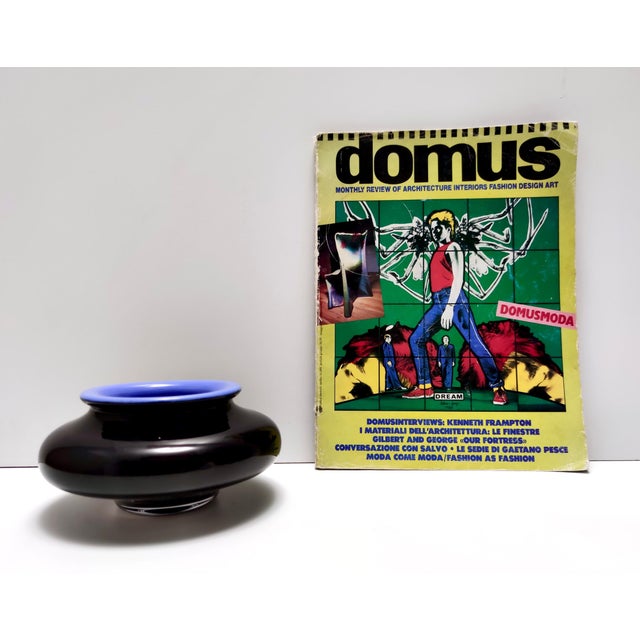 Made in Italy, Murano, 1980s. It is made in quite heavy 3-layered iridescent black and cornflower blue hand-blown cased...