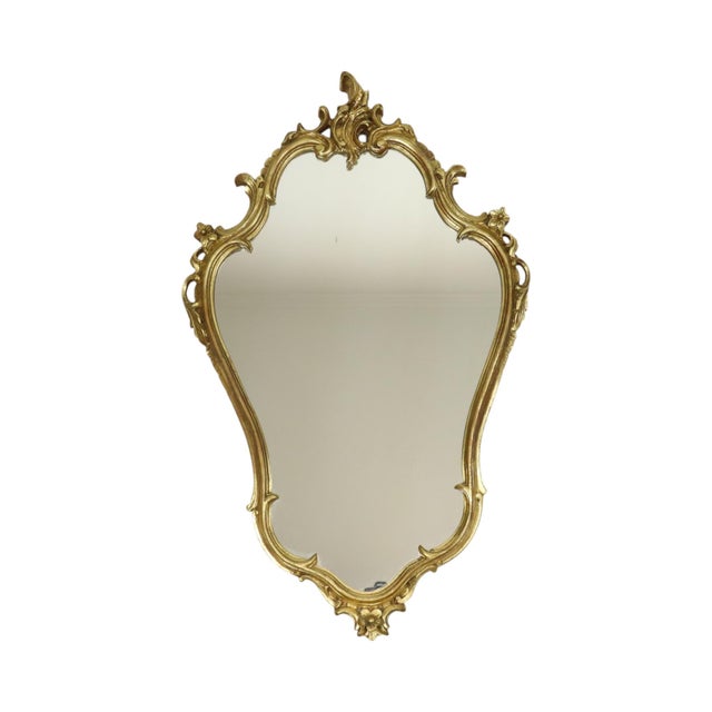 Beautiful gilded mirror with console, entirely in the classic Rococo style; France, circa mid-20th century. A lovely...