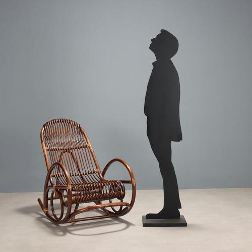 Vintage rocking chair made of bamboo. This piece is attributed to the mentioned designer/maker. It has no attribution mark...