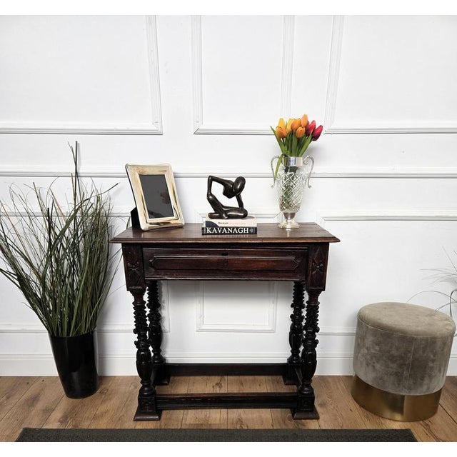 Very elegant and refined Italian antique console side table. Standing on four beautifully carved wooden legs with beveled...
