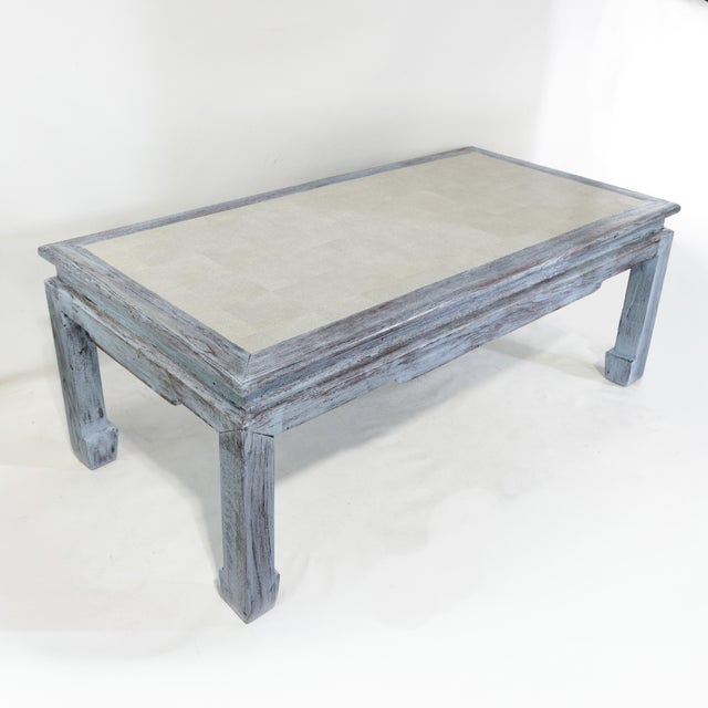 This sophisticated coffee table masterfully blends Eastern form with Scandinavian-inspired finishes, featuring a...