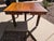 This early 20th century American library table is crafted entirely from solid oak and exemplifies the durability and...