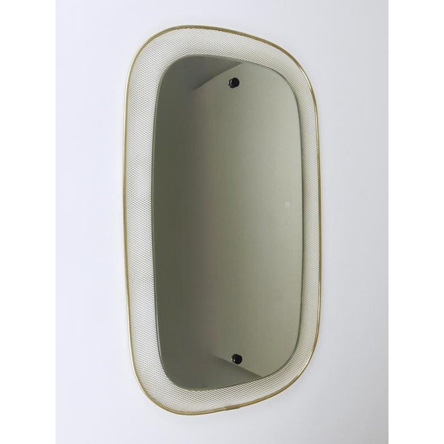 A lovely decorative wall mirror from the 1950s, crafted by vereinigte werkstätten für kunst im handwerk, munich, germany....