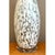Crafted in hand-blown Art Glass, this striking mid-century table lamp features an elongated amphora-style silhouette with...