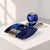 An elegant Italian smoking set from the 1970s, crafted from cobalt blue Murano glass and chrome-plated metal in the...
