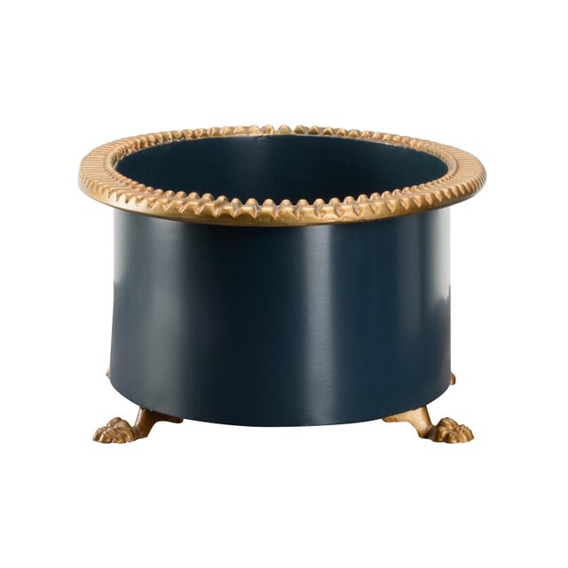 Beautiful oval planter with pie crust edge on gold feet. Designed by Claire Bell.