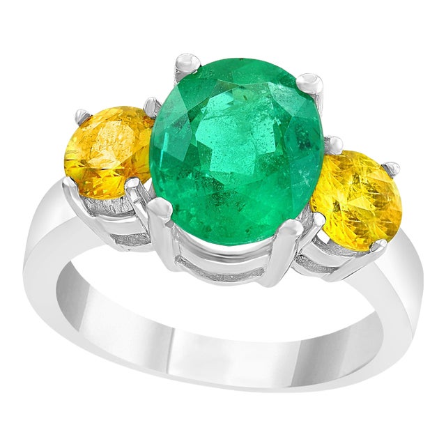 3 Carat Oval Cut Colombian Emerald and Yellow Sapphire 18 Karat Gold Ring For Sale