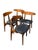 Set of 4 fantastic vintage Danish Greta dining chairs. The seats are covered with black leather with a thin stylized back....